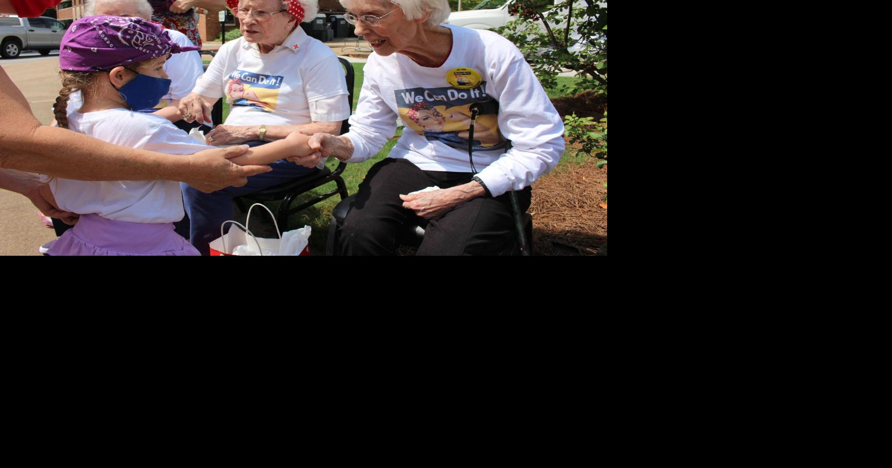 Small crowd gathers at Rosie the Riveter Garden to celebrate Rosies