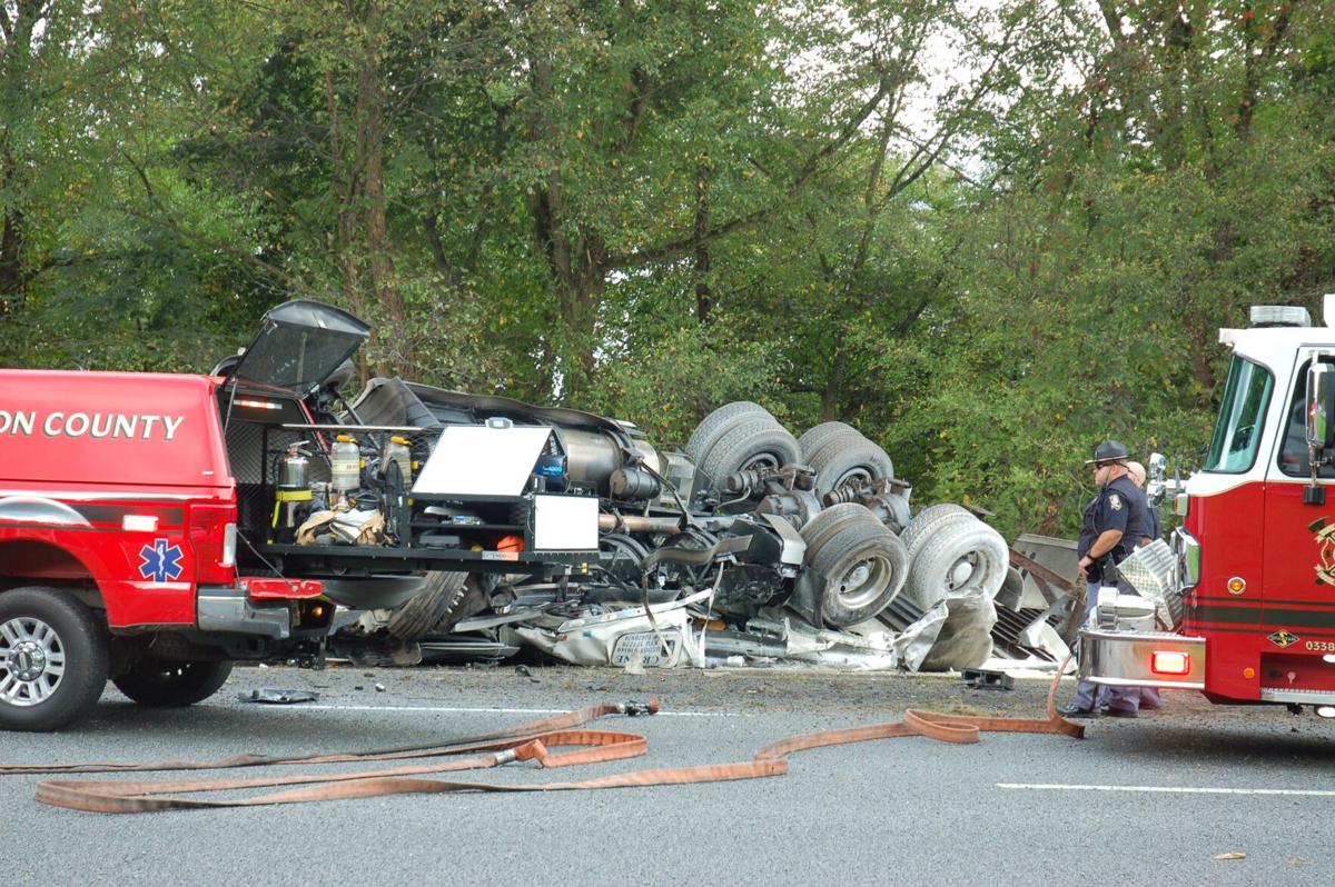 Semi truck overturns, catches fire on I-75 near Adairsville