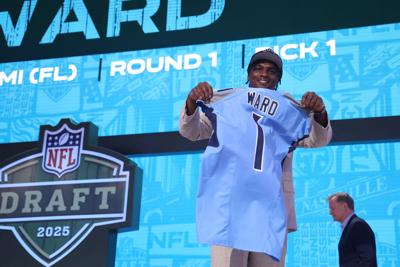 Quarterback Cam Ward of Miami celebrates after being selected first overall pick by the Tennessee Titans during the first round of the NFL Draft at Lambeau Field on Thursday, April 24, 2025, in Green Bay, Wisconsin.