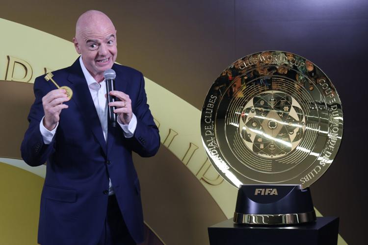 FIFA president Gianni Infantino shows the key to the trophy after unveiling the highly designed trophy as FIFA held its media preview for the Club World Cup at the FIFA Miami headquarters in Coral Gables, Florida, on Tuesday, May 10, 2025. (copy)