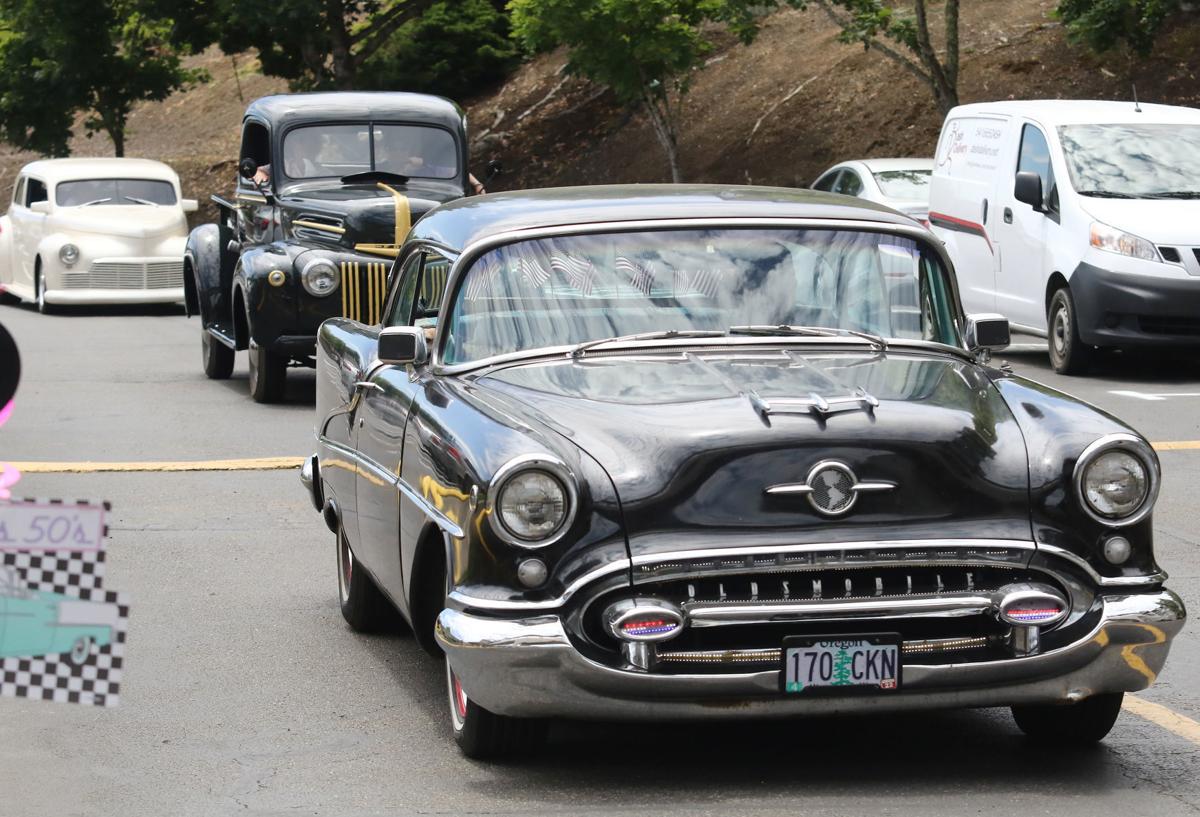 Classic cars cruise by retirement homes in Roseburg Classic cars cruise by retirement homes in Roseburg