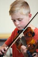 Fiddle convention draws prodigies and pros