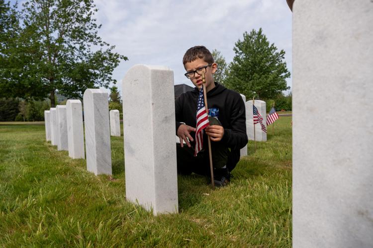 Fir Grove Elementary students plant flags at VA Cemetery ahead of