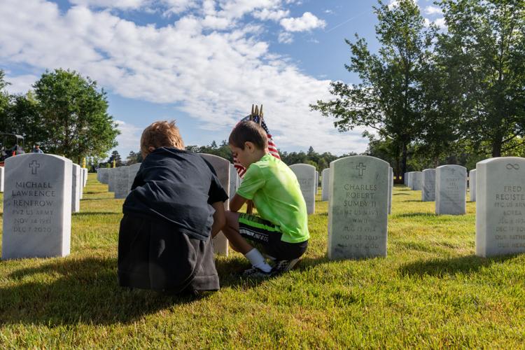 Fir Grove Elementary students plant flags at VA Cemetery ahead of