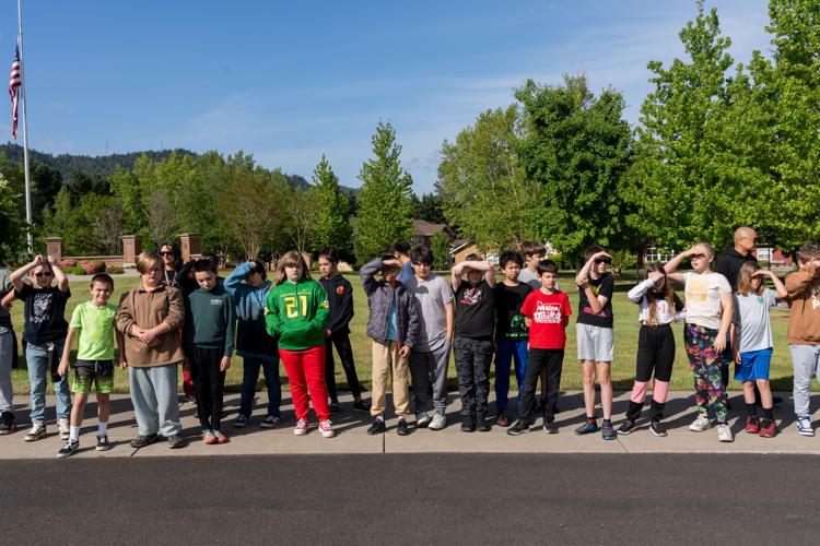 Fir Grove Elementary students plant flags at VA Cemetery ahead of