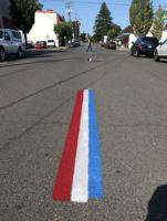 Red, white and blue road markings are liked by residents, but may cause legal issues for City of Myrtle Creek