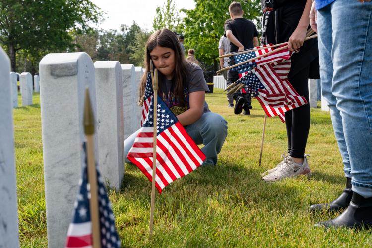 Fir Grove Elementary students plant flags at VA Cemetery ahead of ...