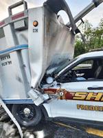 Dump-truck bed strikes deputy's cruiser