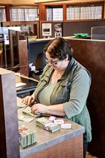 April Konz counts money