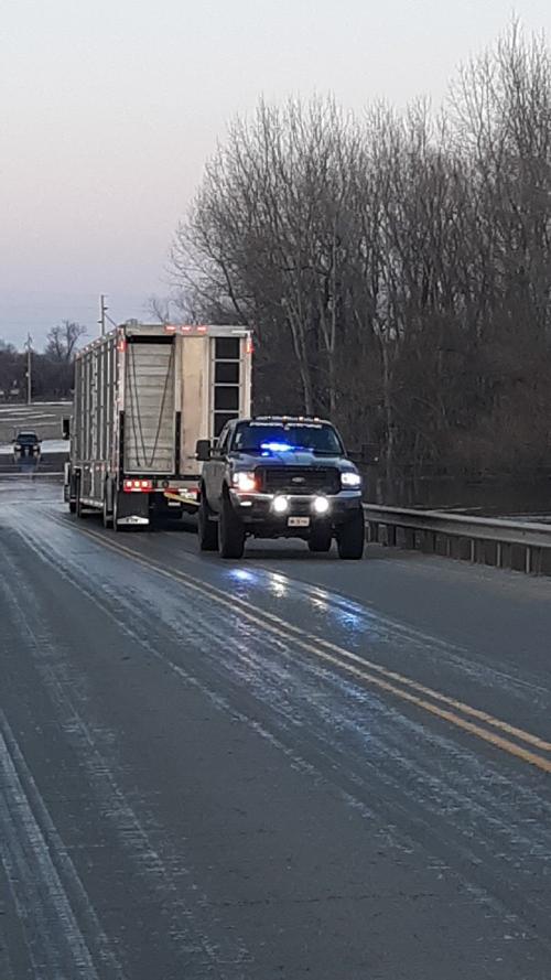 Two vehicles stranded in flood waters