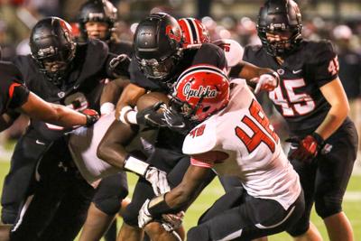central opelika football school phenix city vs oanow garrett harrison carries ball during game