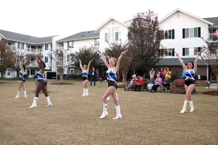 Auburn High majorettes spread holiday cheer at Monarch Estates
