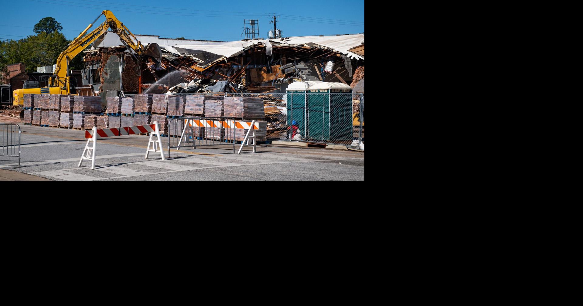 Construction crew demolishes Stone Martin Builders building after fire