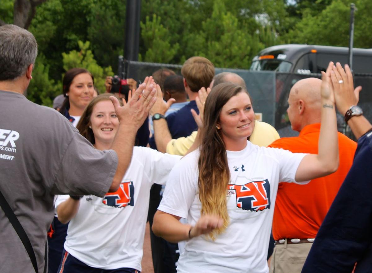 Auburn fans softball team home from Women’s College World