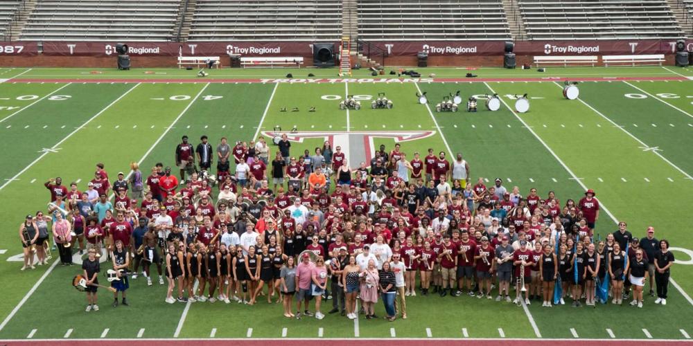 Marching band alumni return for reunion weekend, recognize Walker’s 25 years at TROY