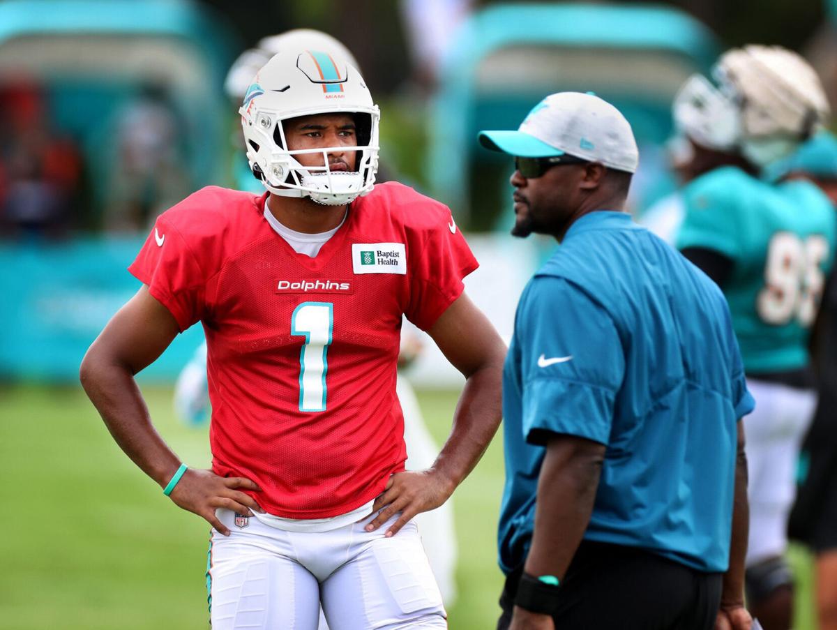 Miami Dolphins quarterback Tua Tagovailoa and Coach Brian Flores during practice at the Baptist Health Training Complex at Hard Rock Stadium on Tuesday August 3, 2021 in Miami Gardens, FL..