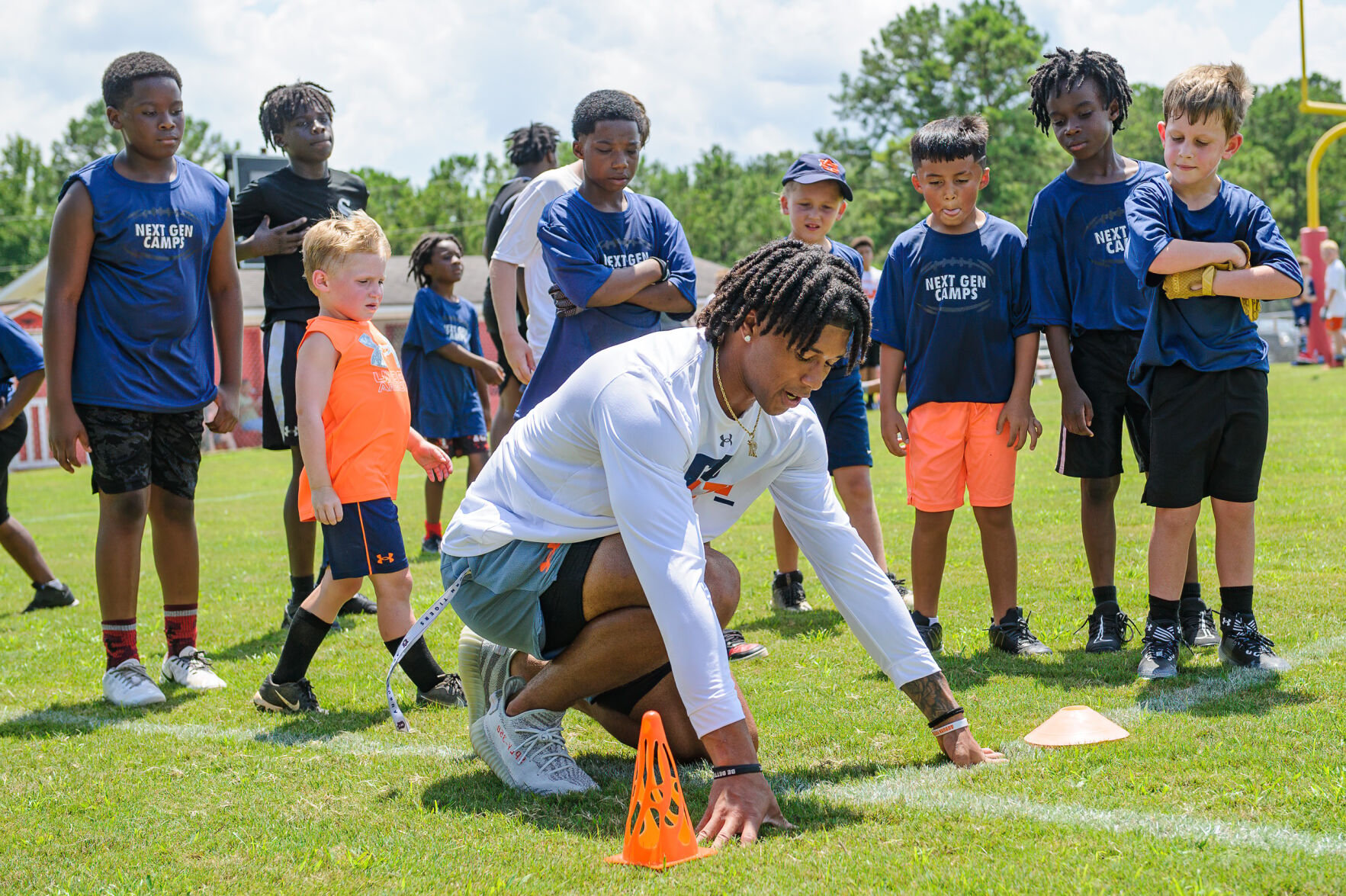 Giving back Auburn players host 100plus kids at youth football camp
