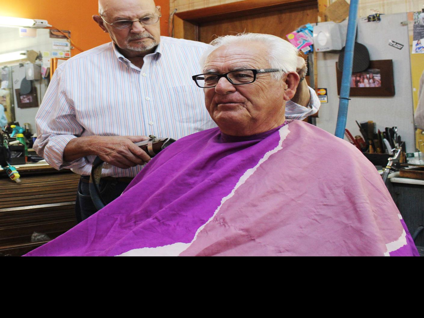 Longtime Auburn barber turns off the clippers after 56 years