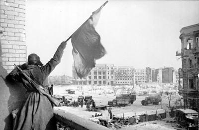139 Victorious Soviet soldier waving Red banner in Stalingrad