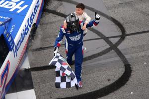 Kyle Busch, driver of the No. 7 truck sponsored by HendrickCars.com Chevrolet, is congratulated by his son, Brexton Busch after winning the NASCAR Craftsman Truck Series Fr8 Racing 208 at Echo Park Speedway on February 21, 2026 in Hampton, Georgia. (