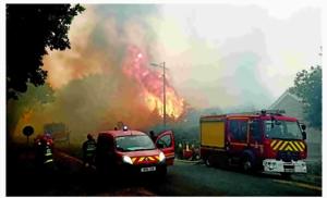 Wildfire forces thousands to flee