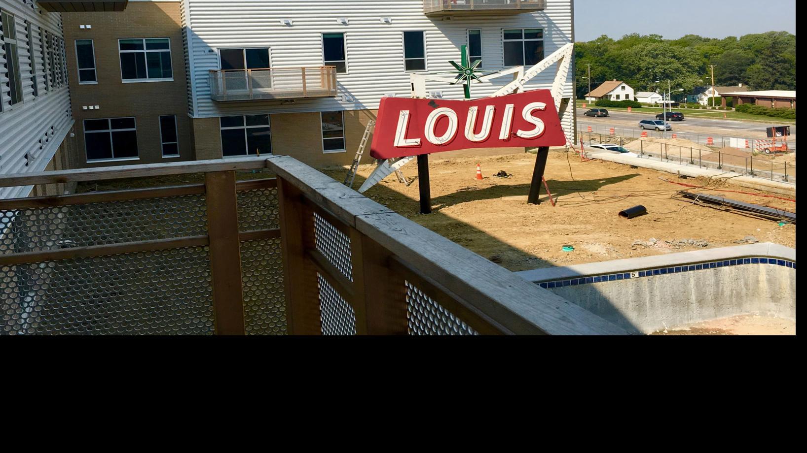 iconic louis market sign has a new home at recently developed benson lights apartments money omaha com