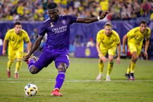 Orlando City forward Daryl Dike (18) scores on a penalty kick during the second half against Nashville SC at Nissan Stadium in
