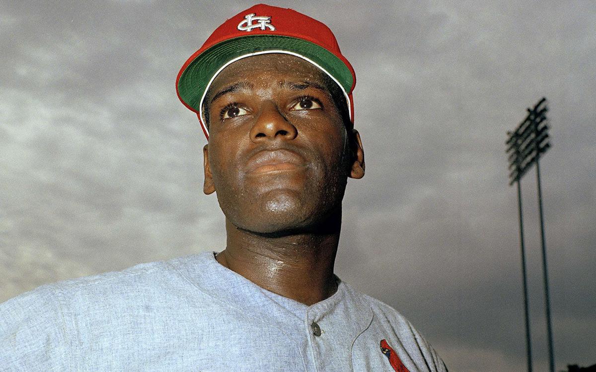 Bob Gibson and his wife, Charlene,with the 1965 Corvette awarded