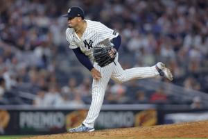 Aug 7, 2026; Bronx, New York, USA; New York Yankees relief pitcher Fernando Cruz (63) follows through on a pitch against the Atlanta Braves during the seventh inning at Yankee Stadium. Mandatory Credit: Brad Penner-Imagn Images