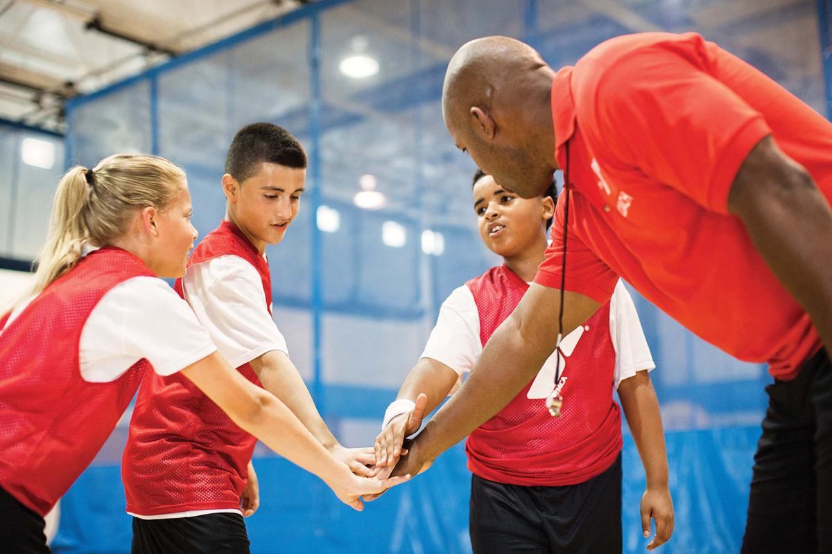 YMCA coaches Youth sports teach fundamentals, but that's not the big