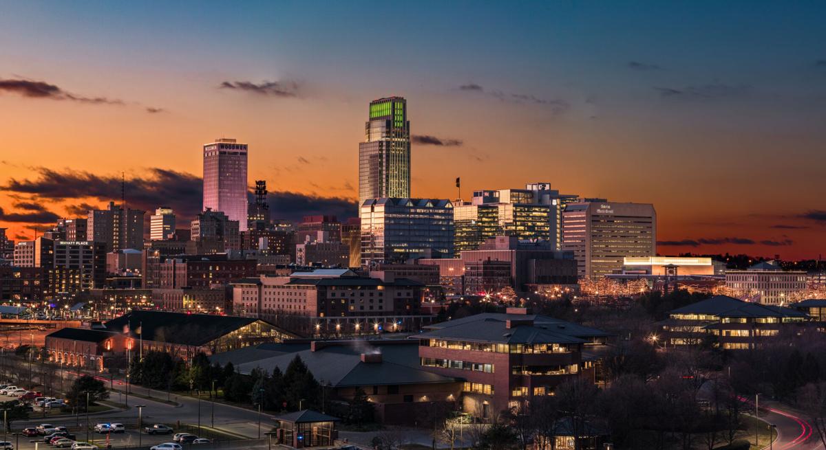 Illuminated Buildings In City Against Sky During Sunset