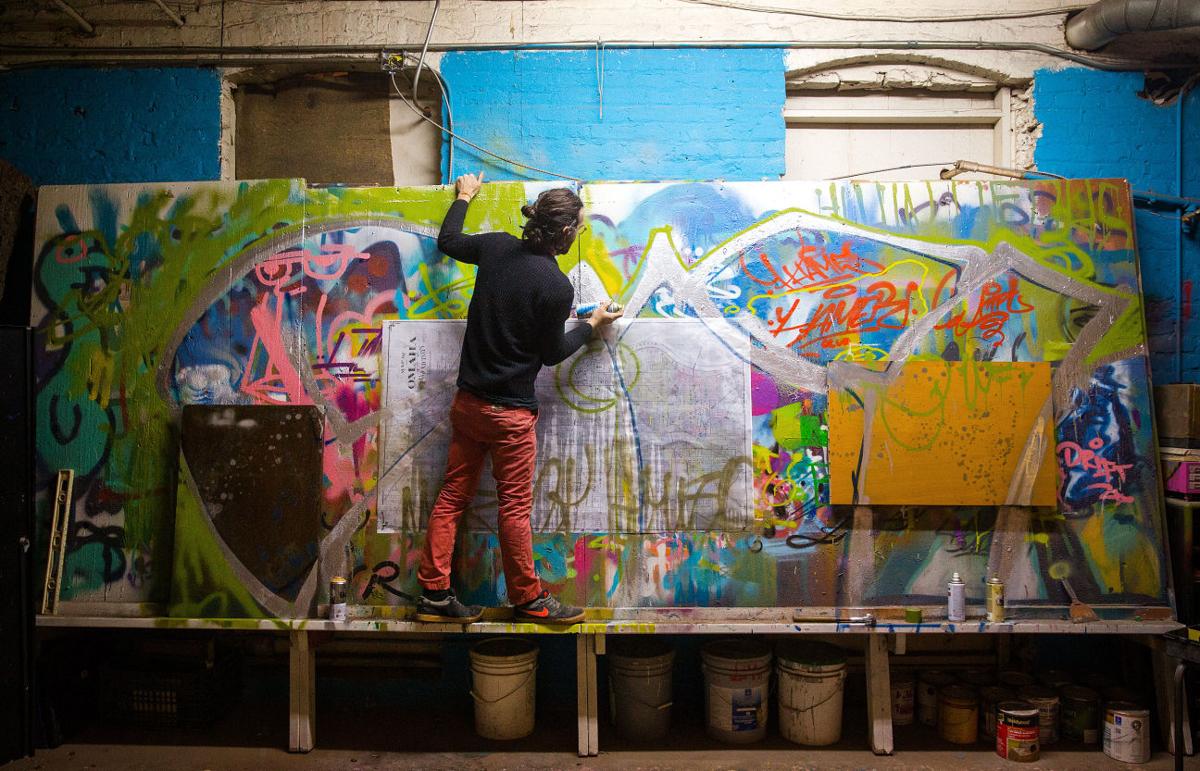 Omaha artists painting over graffiti with graffiti GO Arts