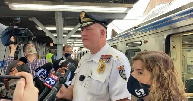 Police: commuters held up phones as woman raped