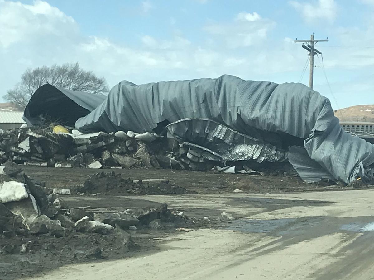 Propelled by ferocious floodwaters, huge ice chunks batter buildings in