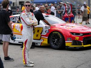 NASCAR Cup Series driver Daniel Dye (78) stands as his car is pushed into a garage Friday, July 24, 2026, during practice for