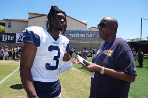 Jul 27, 2025; Oxnard, CA, USA; USA Today Sports reporter Jarrett Bell (right) interviews Dallas Cowboys receiver George Pickens (3) at training camp at the River Ridge Fields. Mandatory Credit: Kirby Lee-Imagn Images