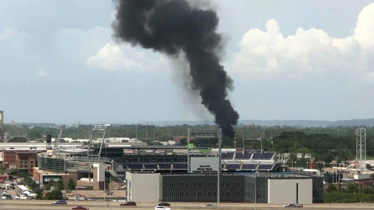 Fire breaks out at north downtown Omaha salvage yard; plumes of black