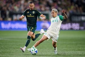 Mar 1, 2025; Portland, Oregon, USA; Austin FC midfielder Daniel Pereira (8) controls the ball during the first half against Portland Timbers forward Ariel Lassiter (7) at Providence Park. Mandatory Credit: Troy Wayrynen-Imagn Images