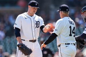 Detroit Tigers pitcher Tarik Skubal (29) hands the ball to manager A.J. Hinch (14) for pitching change against Milwaukee Brewers during the seventh inning at Comerica Park in Detroit on Thursday, April 23, 2026.