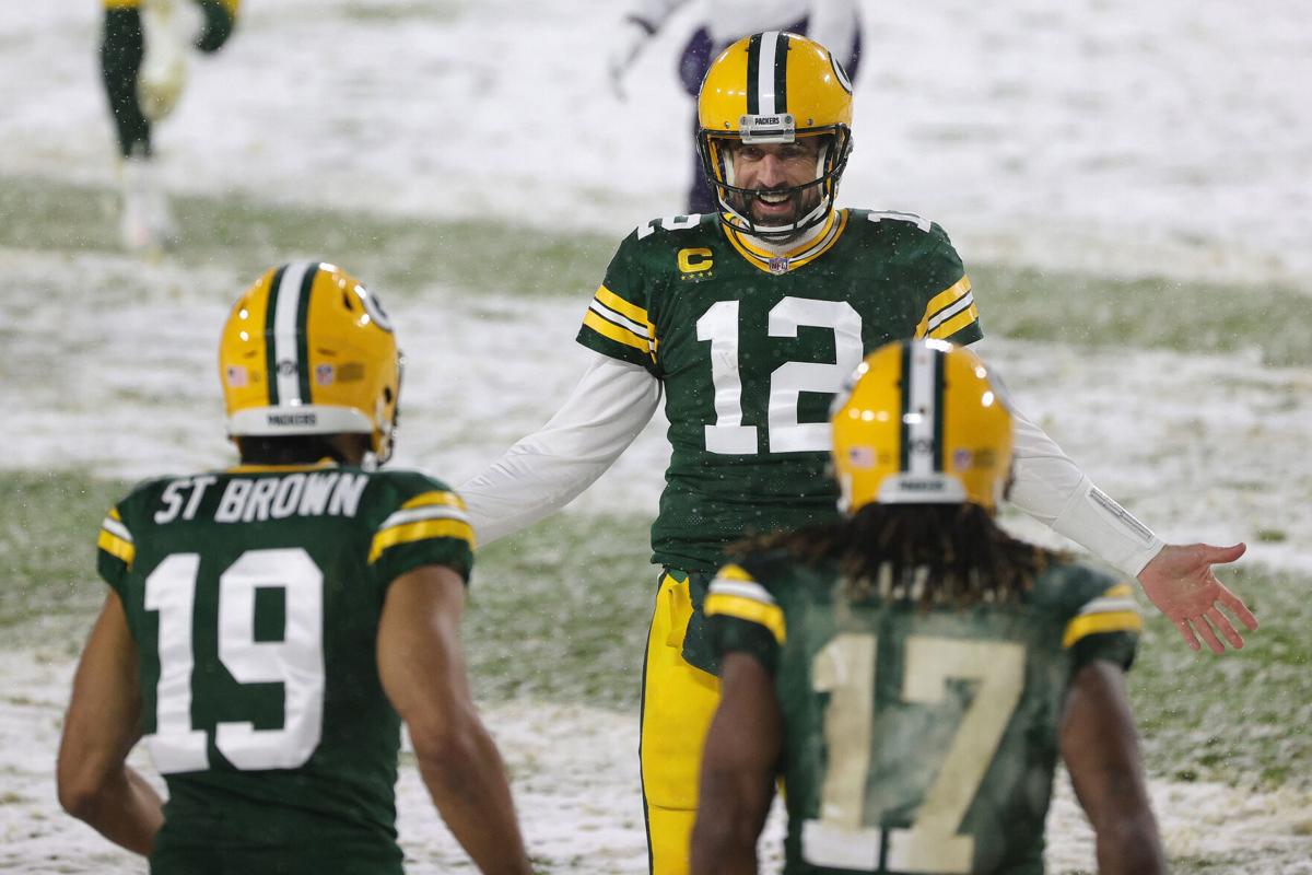 Quarterback Aaron Rodgers #12 of the Green Bay Packers celebrates a touchdown pass to Equanimeous St. Brown #19 against the Tennessee Titans during the second quarter at Lambeau Field on Dec. 27, 2020 in Green Bay, Wisconsin.