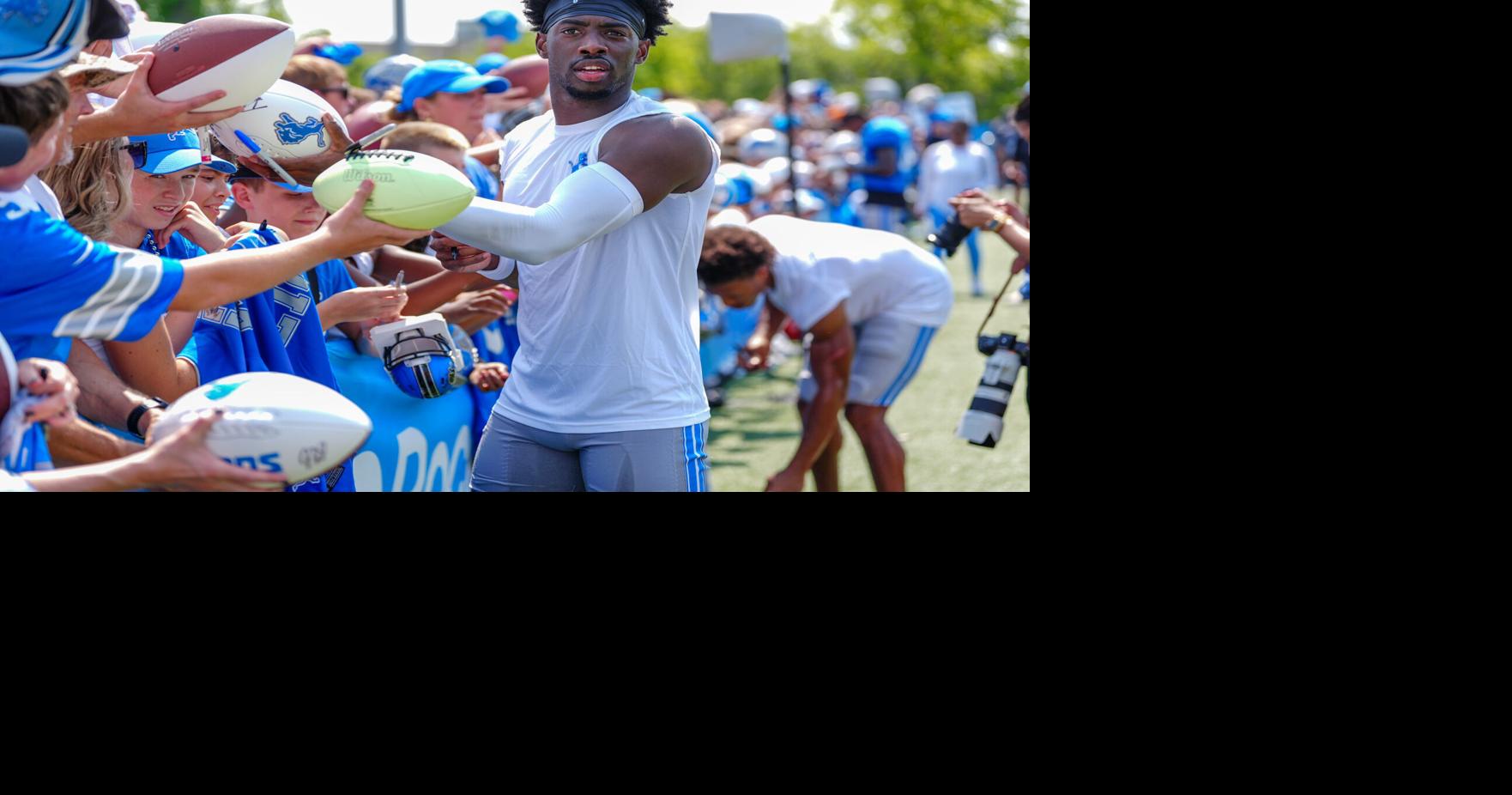 Detroit Lions CB Terrion Arnold signs autographs at the end of the joint practice with the Miami Dolphins at the Lions