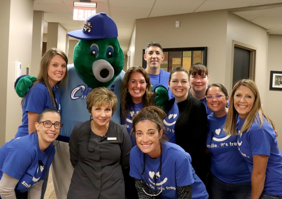 Omaha dentist gives back smiles in community, beyond