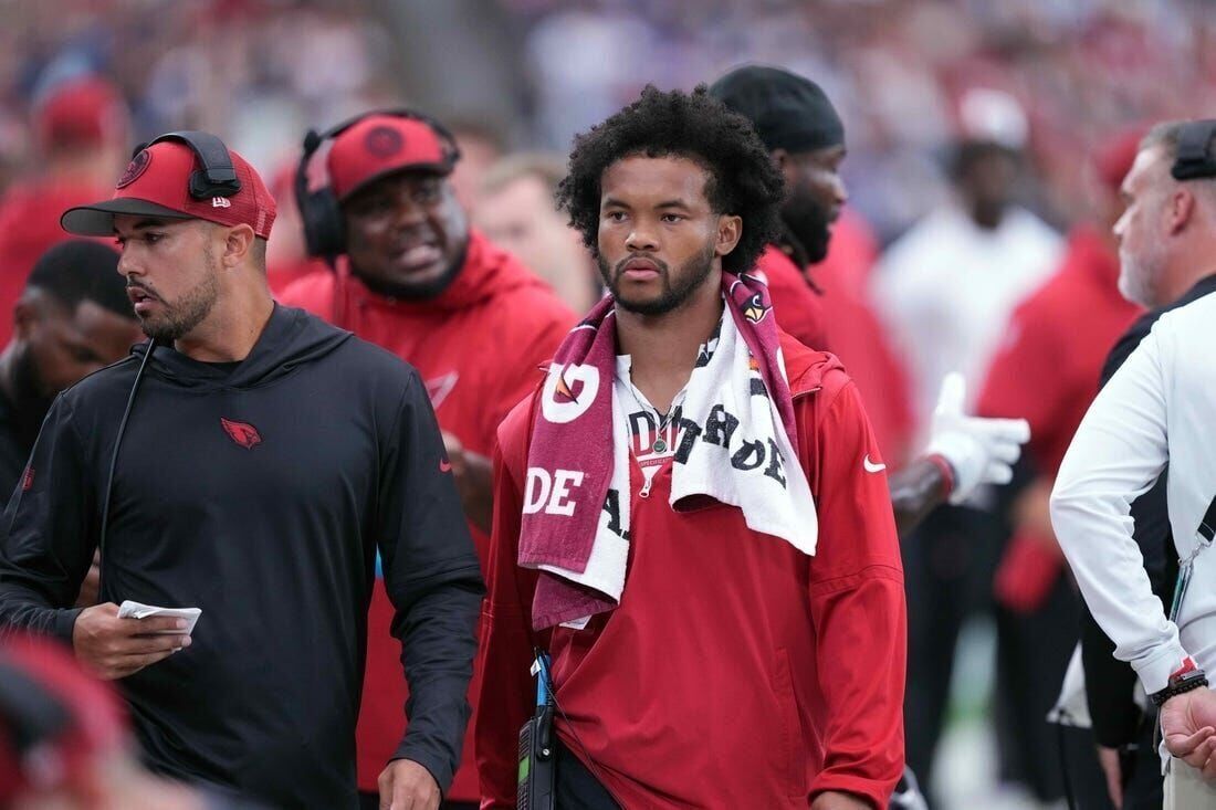 Oklahoma quarterback Kyler Murray holds his up a jersey after the Arizona  Cardinals selected Mu …