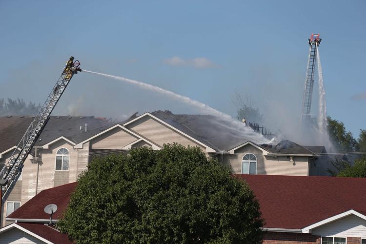 Firefighter, 2 others injured as roof collapses at Bellevue apartment fire