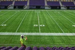 Construction worker Vincent Carbone takes a drink of water while working on Northwestern University’ s nearly finished Ryan Field on Sept. 14, 2026, in Evanston, Ill..