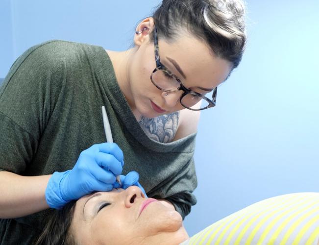 Microblading specialist at work