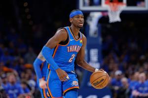 Oklahoma City Thunder guard Shai Gilgeous-Alexander dribbles down the court against the Los Angeles Lakers in the second half during game one of the second round of the 2026 NBA Playoffs at Paycom Center.