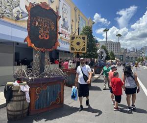 Universal Orlando visitors walk through preparations for Halloween Horror Nights, which launches at Universal Studios Florida theme park on Aug. 27, 2026.
