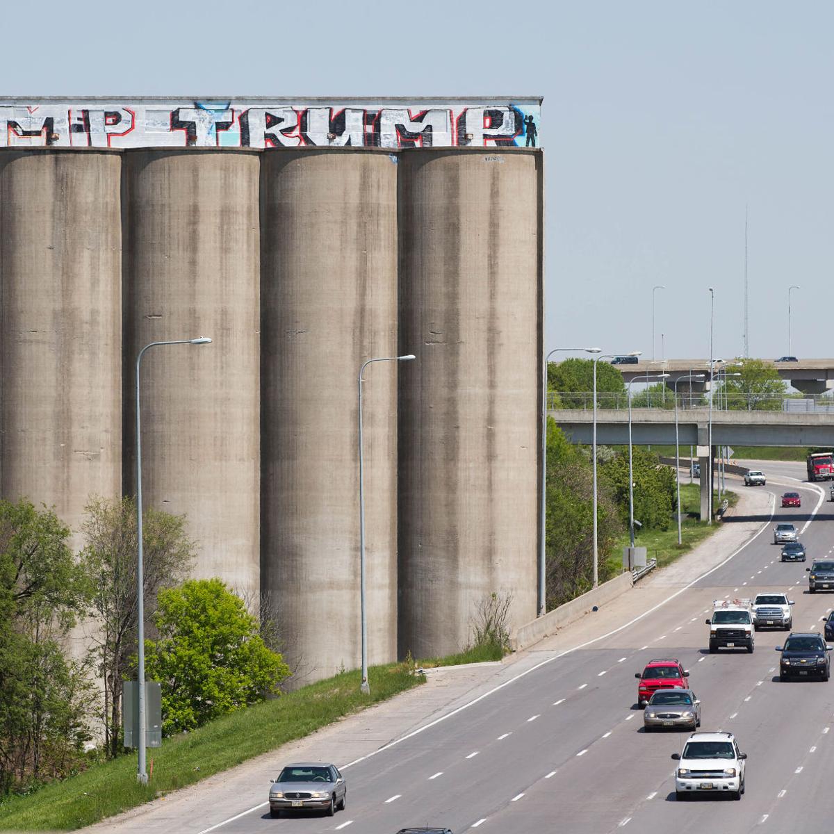 Ahead Of Omaha Rally Dump Trump Graffiti Appears Atop Grain Elevator Flanking I 80 State Regional Omaha Com
