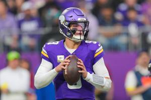 Minnesota Vikings quarterback J.J. McCarthy (9) drops back to pass against the Baltimore Ravens in the second quarter at U.S. Bank Stadium in Minneapolis, Minnesota on Nov. 9, 2025.